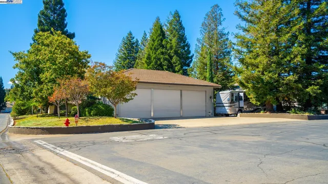 a backyard of a house with a garage