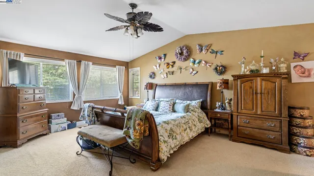 a bed room with a bed and a large mirror