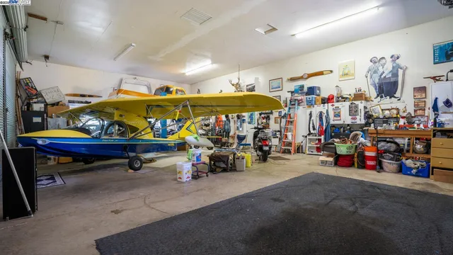 a view of a house with swimming pool and sitting area