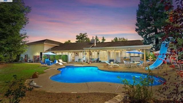 a patio with a patio table and chairs