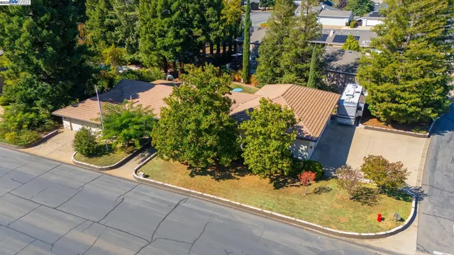 a view of a swimming pool with sitting area