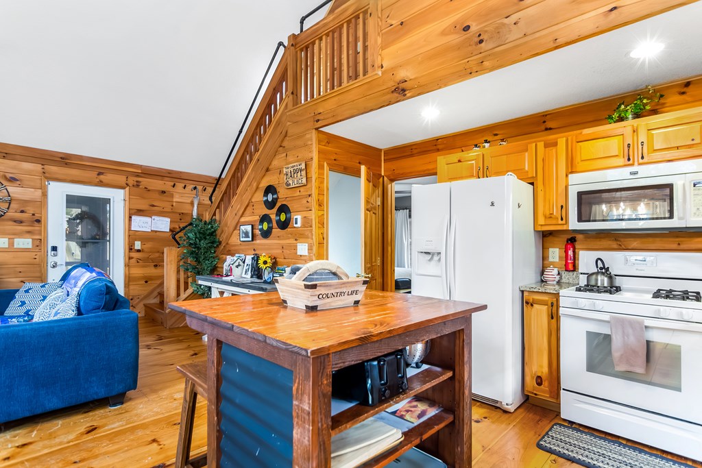 174 Seneca Way Ellijay, GA 30540 - Photo 11 of 36 a view of kitchen with furniture and wooden floor