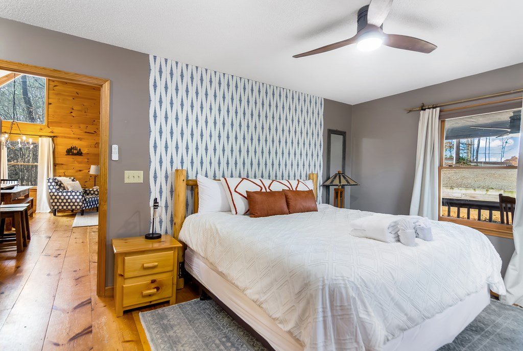 174 Seneca Way Ellijay, GA 30540 - Photo 15 of 36 a bedroom with a bed and wooden floor