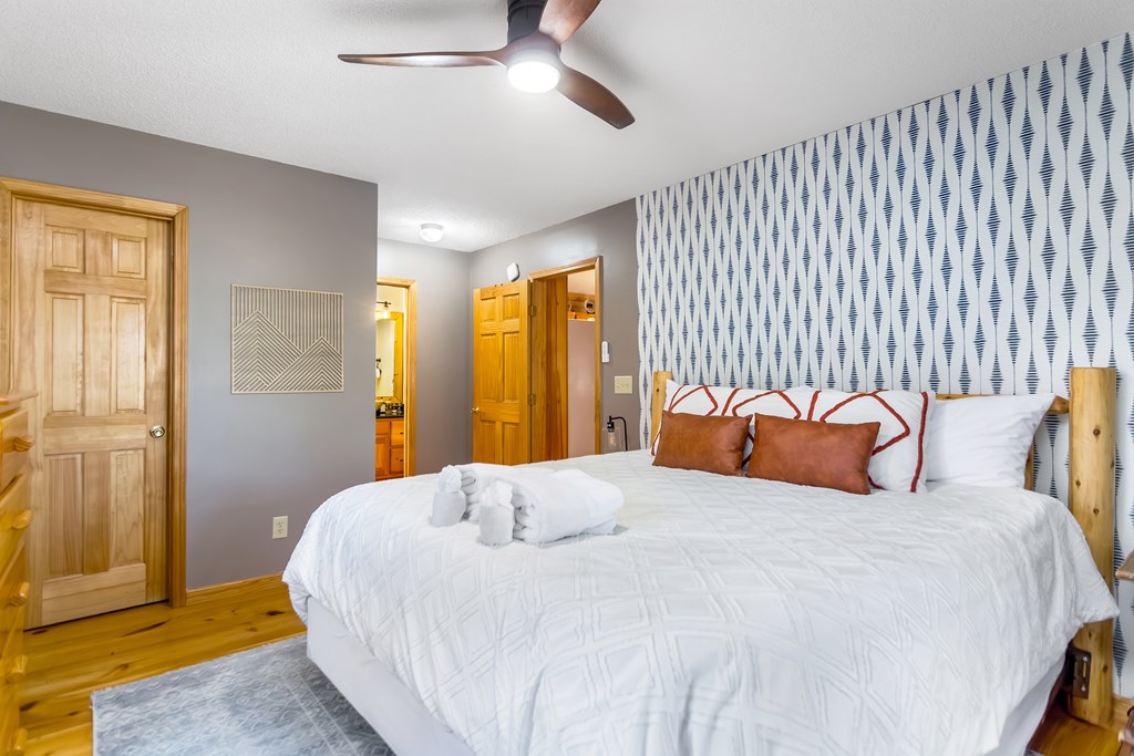 174 Seneca Way Ellijay, GA 30540 - Photo 16 of 36 a bedroom with a bed and a window