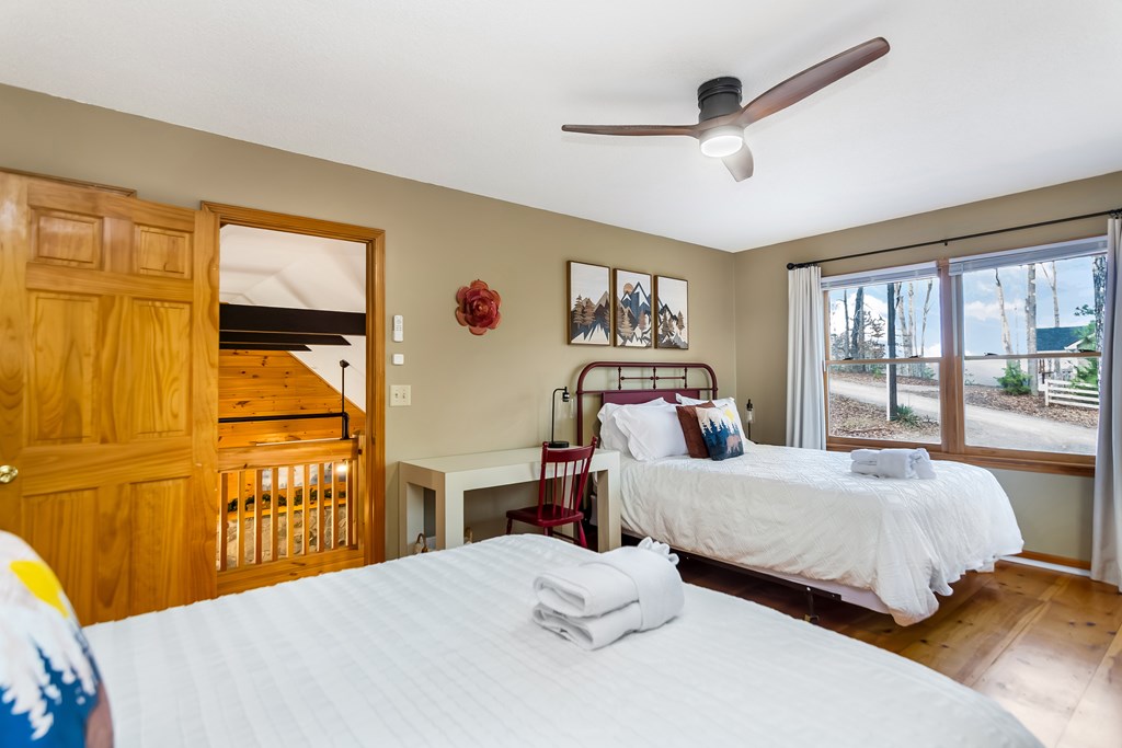 174 Seneca Way Ellijay, GA 30540 - Photo 22 of 36 a bedroom with a bed and a table in it