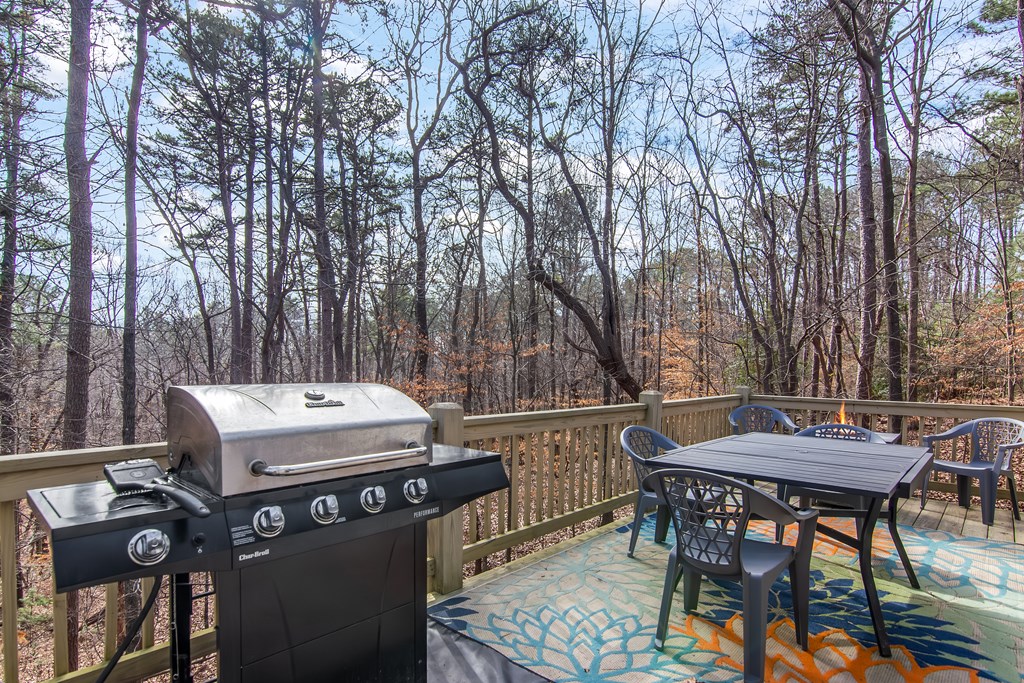 174 Seneca Way Ellijay, GA 30540 - Photo 24 of 36 a view of a dinning tables and chairs in a patio
