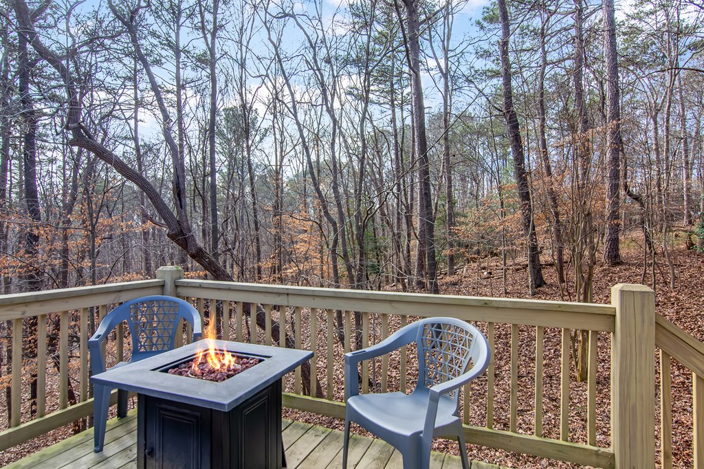 174 Seneca Way Ellijay, GA 30540 - Photo 25 of 36 a view of a chairs and table on the deck