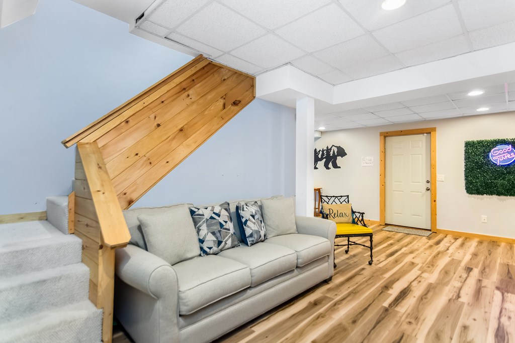 174 Seneca Way Ellijay, GA 30540 - Photo 29 of 36 a living room with furniture and a flat screen tv