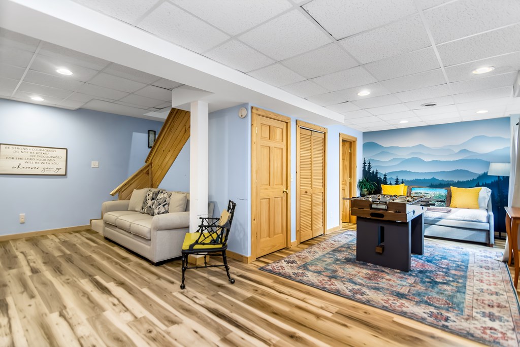 174 Seneca Way Ellijay, GA 30540 - Photo 30 of 36 a living room with furniture and a wooden floor