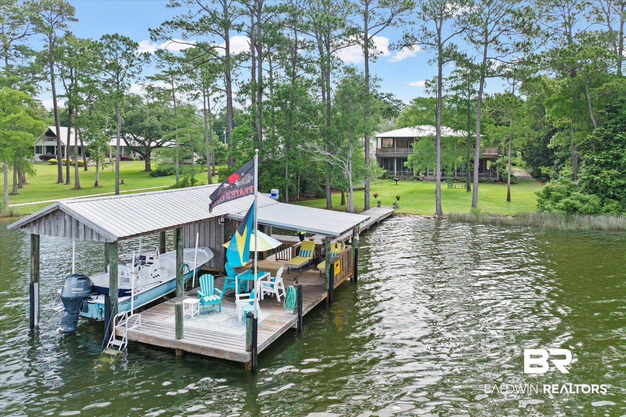 8841 Escambia Avenue Elberta, AL 36530 - Photo 3 of 66 Featuring the wharf area and boat lifts.
