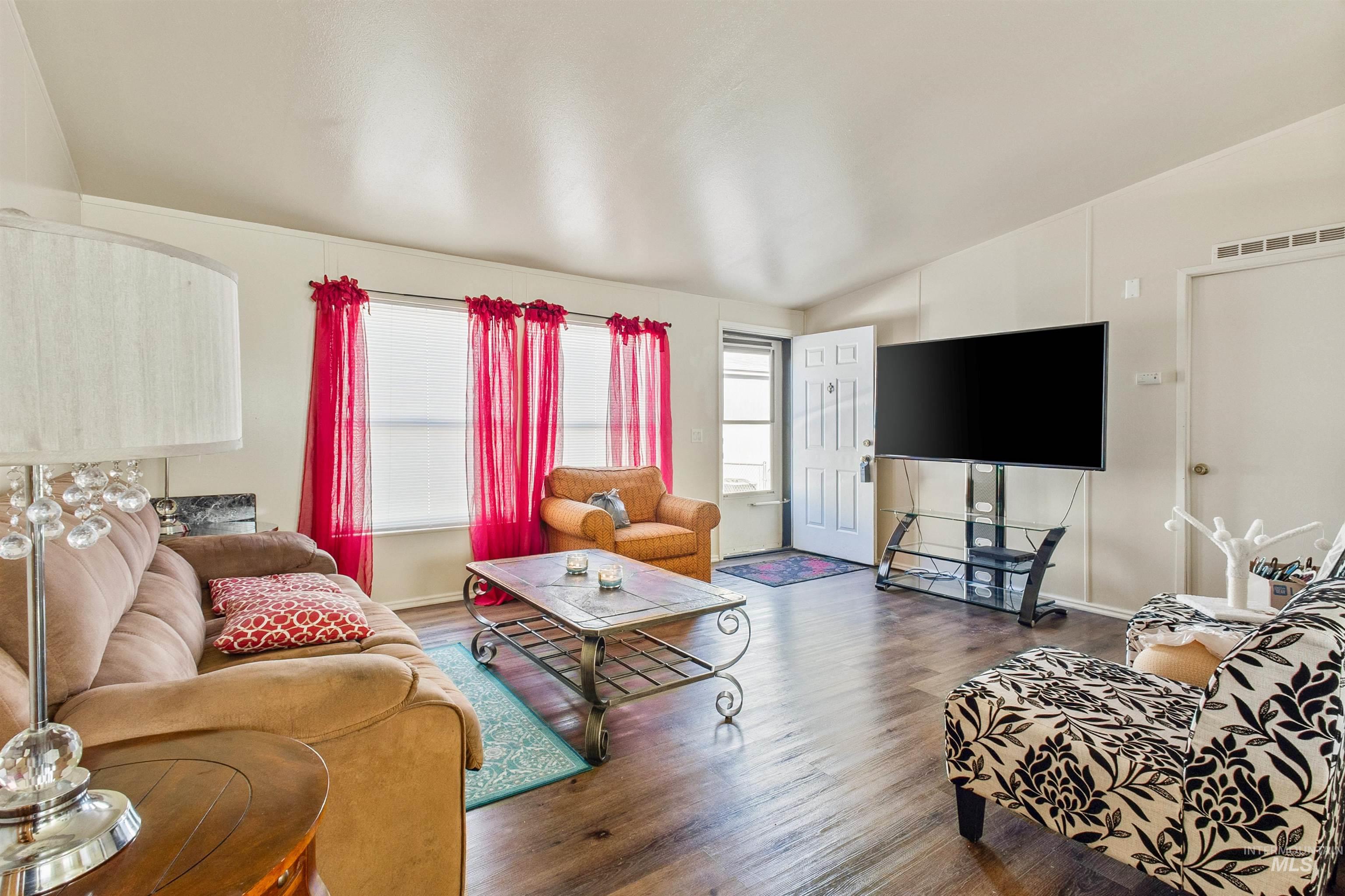 524 West Mesquite Street Boise, ID 83713 - Photo 18 of 29 Living area with lofted ceiling and wood finished floors