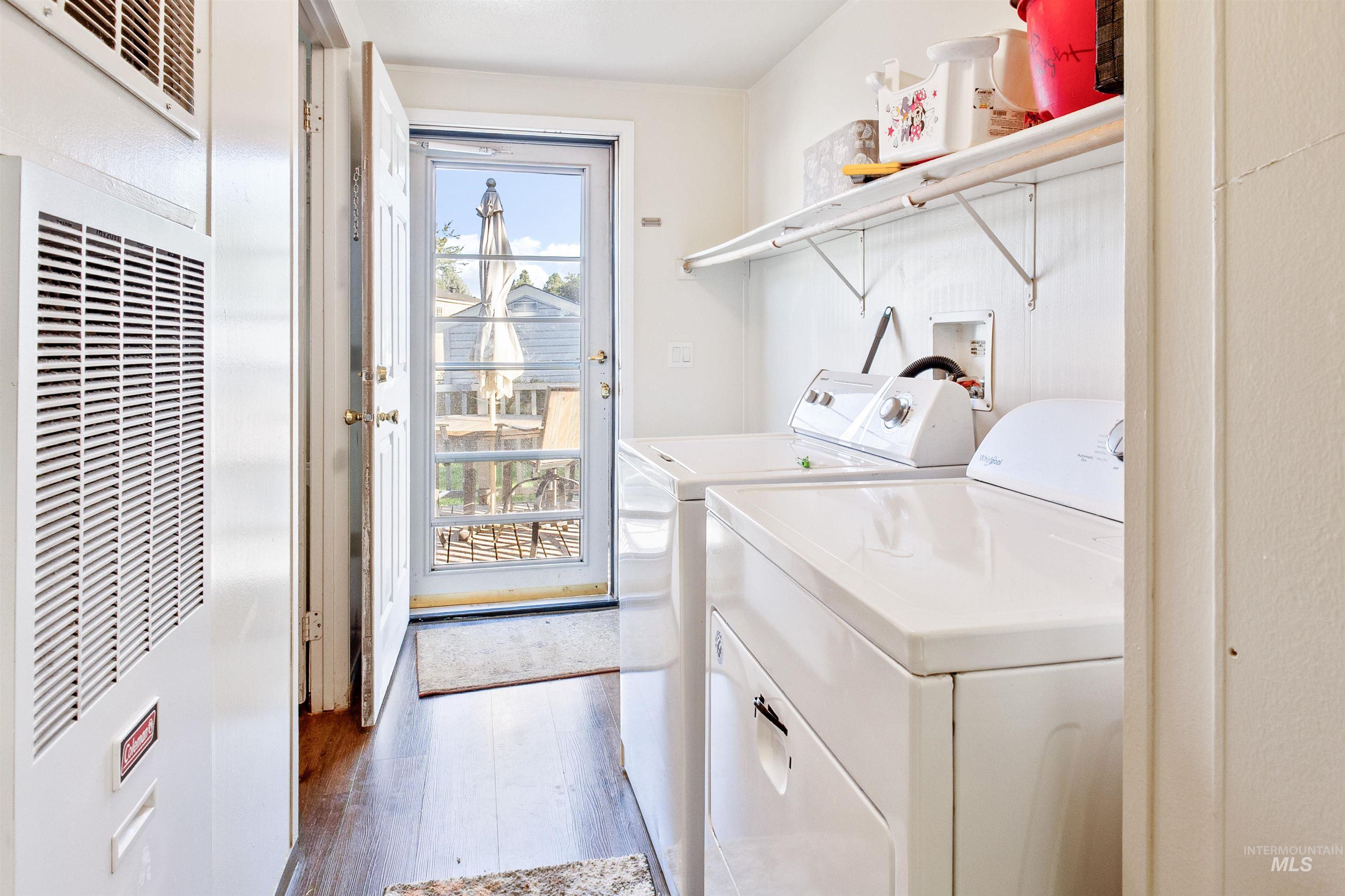 524 West Mesquite Street Boise, ID 83713 - Photo 29 of 29 Washroom featuring a heating unit, dark wood finished floors, and washing machine and dryer