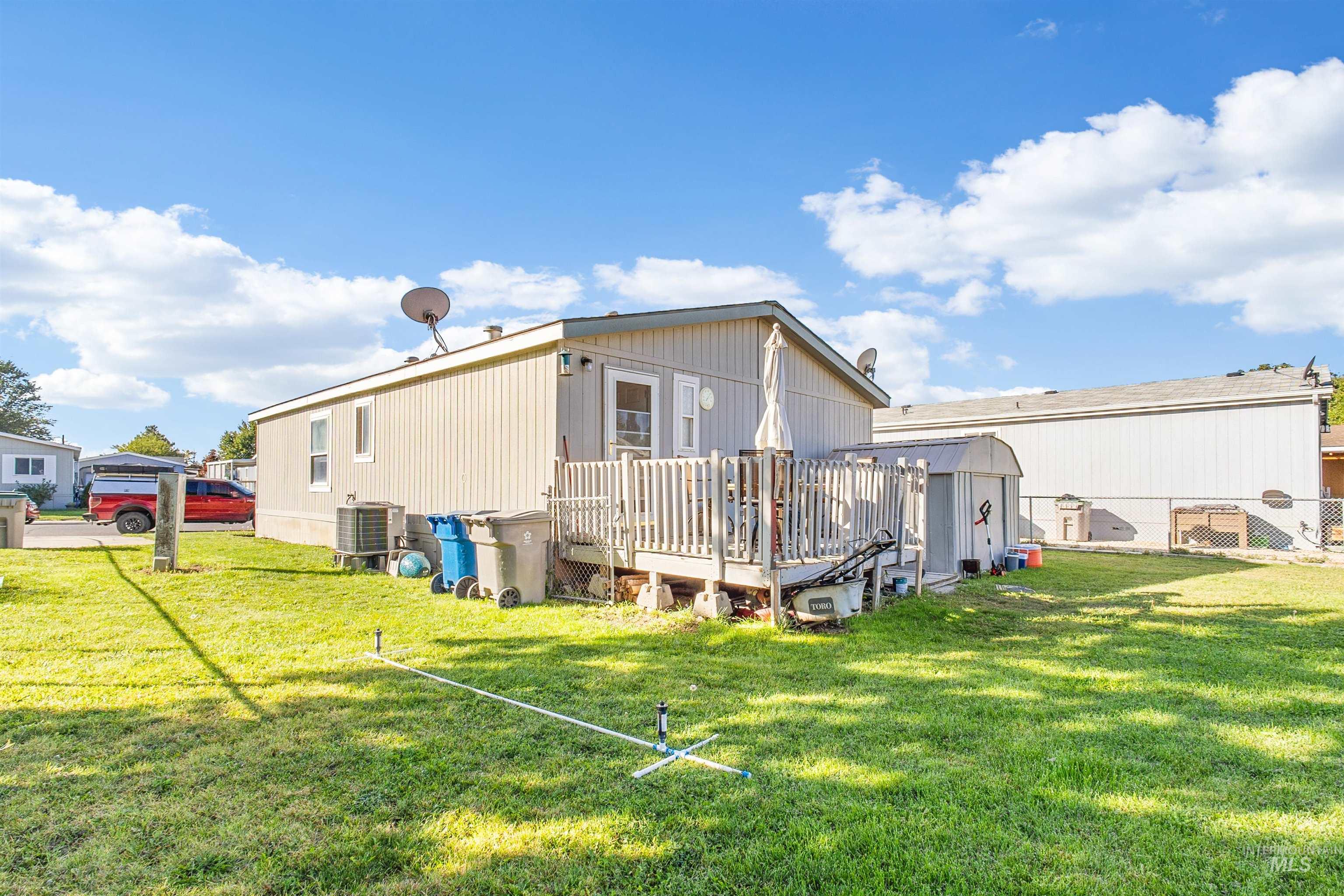 524 West Mesquite Street Boise, ID 83713 - Photo 5 of 29 Back of property with a wooden deck and a storage shed