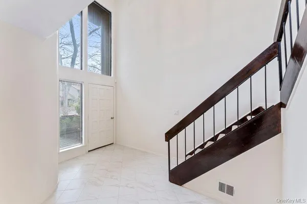 a view of staircase with wooden floor and stairs