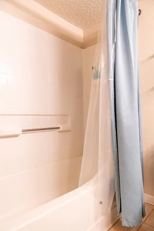 a large white bed in a white room