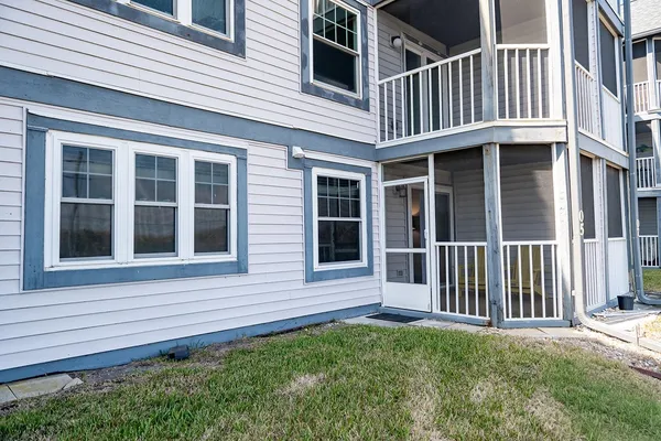 a view of a lake with boats and trees in the background