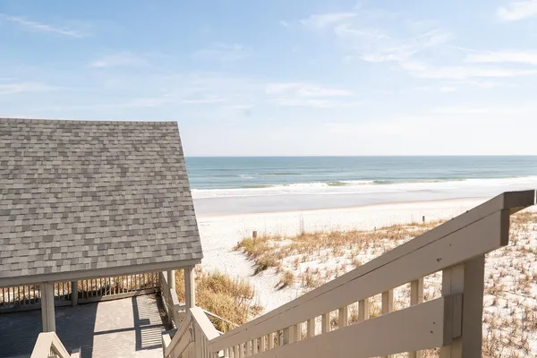 a view of a balcony with wooden floor