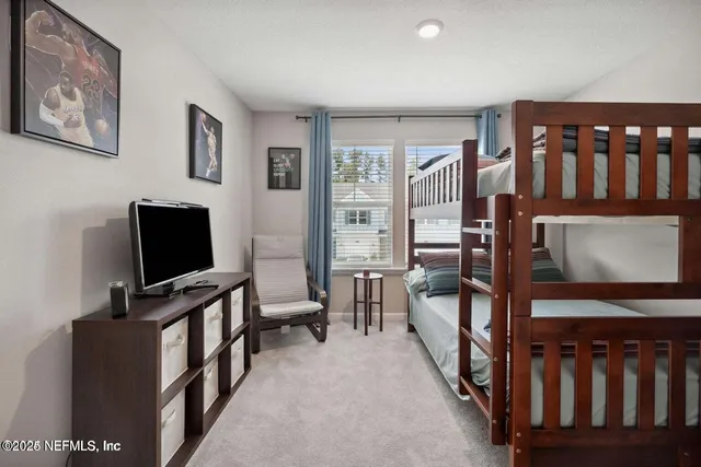 a living room with furniture and flat screen tv