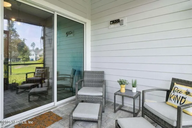 a view of a lake with houses in the back