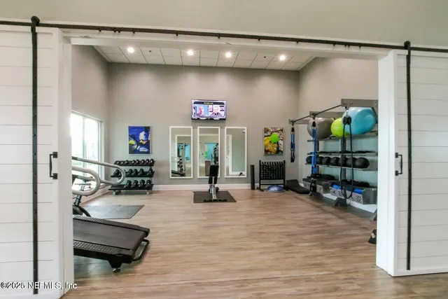 a view of a swimming pool with a garden and sitting area