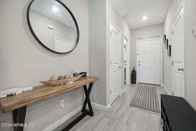 a view of a bathroom with a sink and a mirror