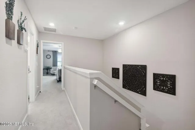 a hallway with cabinets