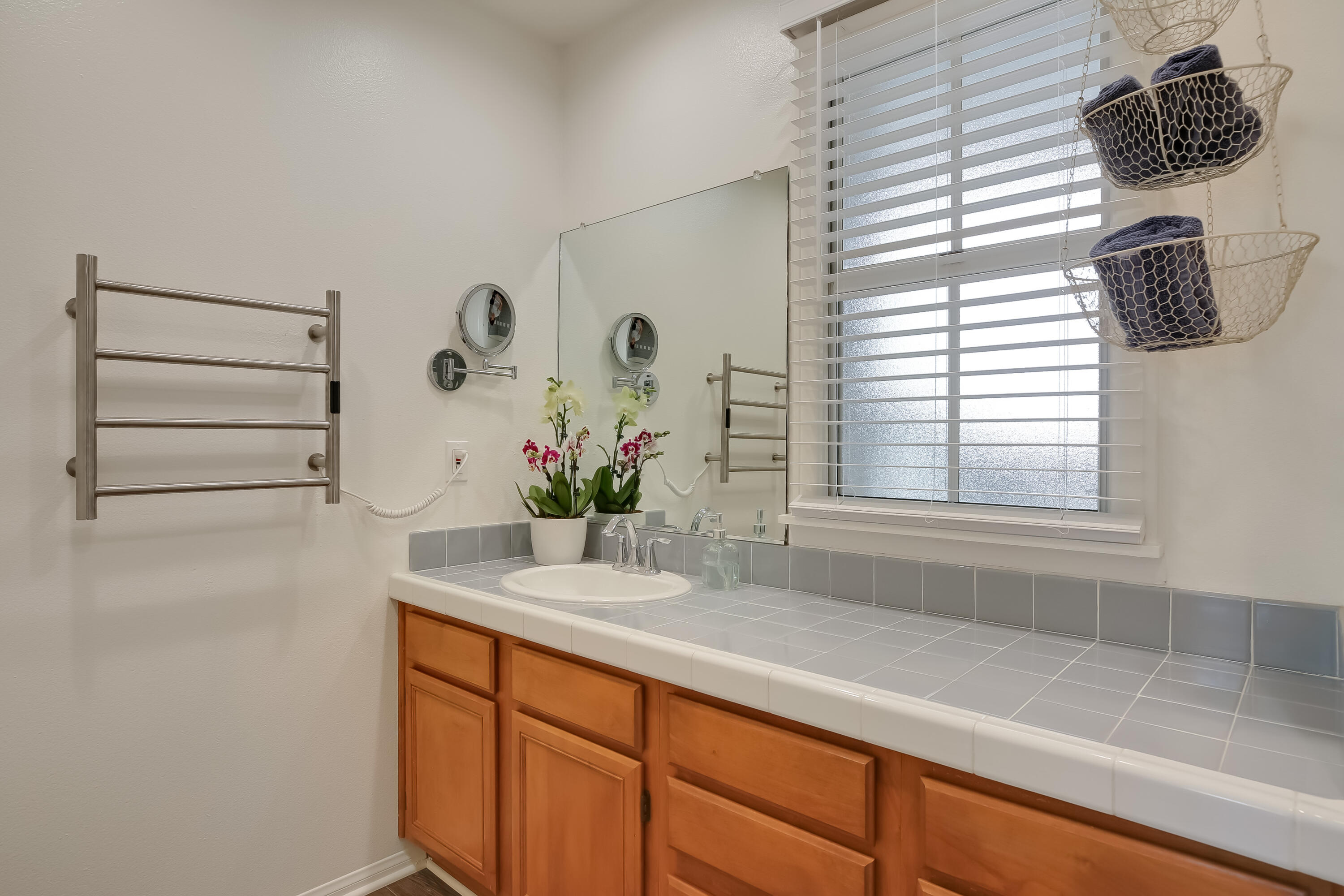 317 5th Street, Unit C Solvang, CA 93463 - Photo 13 of 24 a bathroom with a sink and a mirror