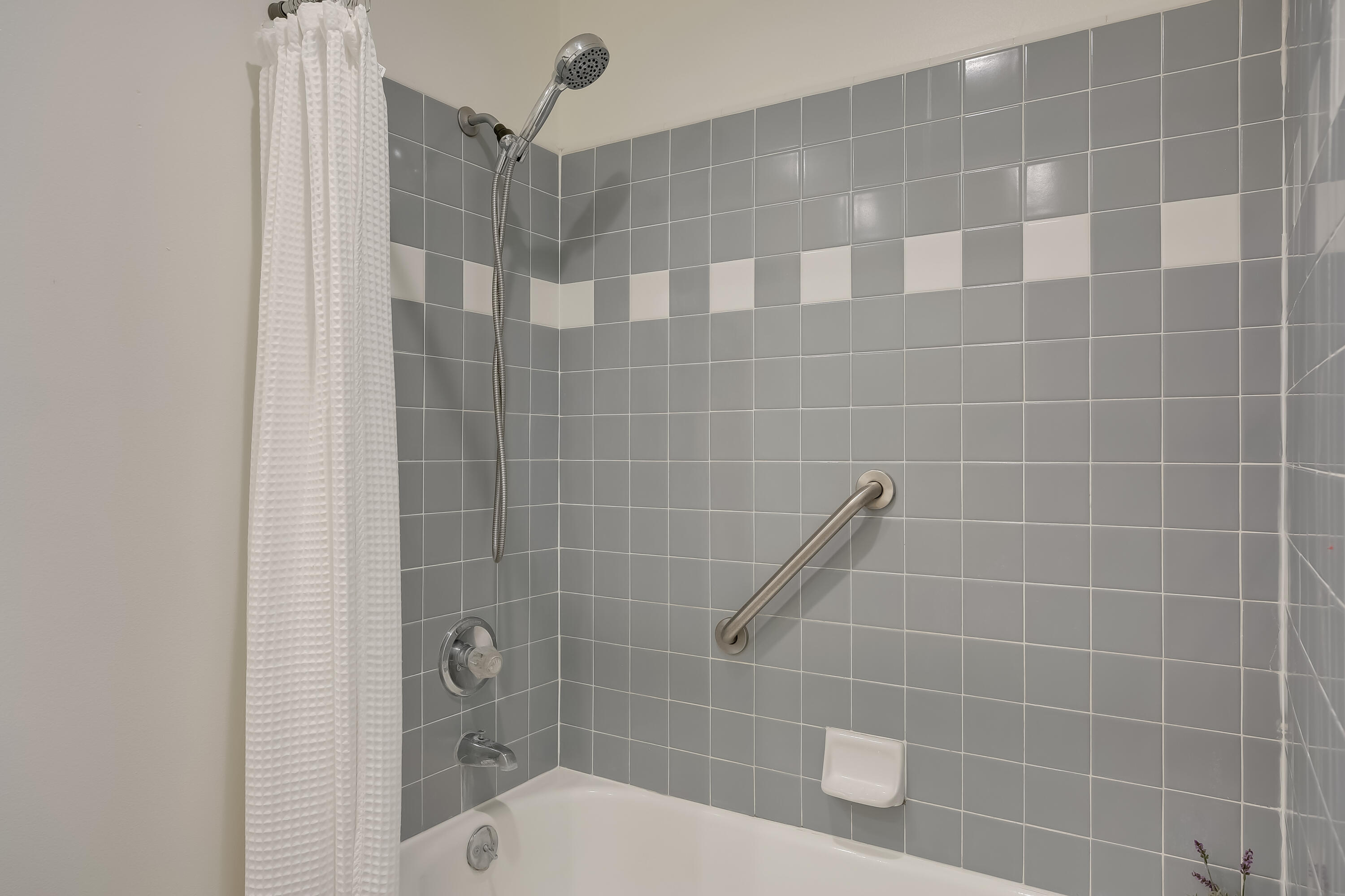 317 5th Street, Unit C Solvang, CA 93463 - Photo 14 of 24 a bathroom with a shower and a toilet