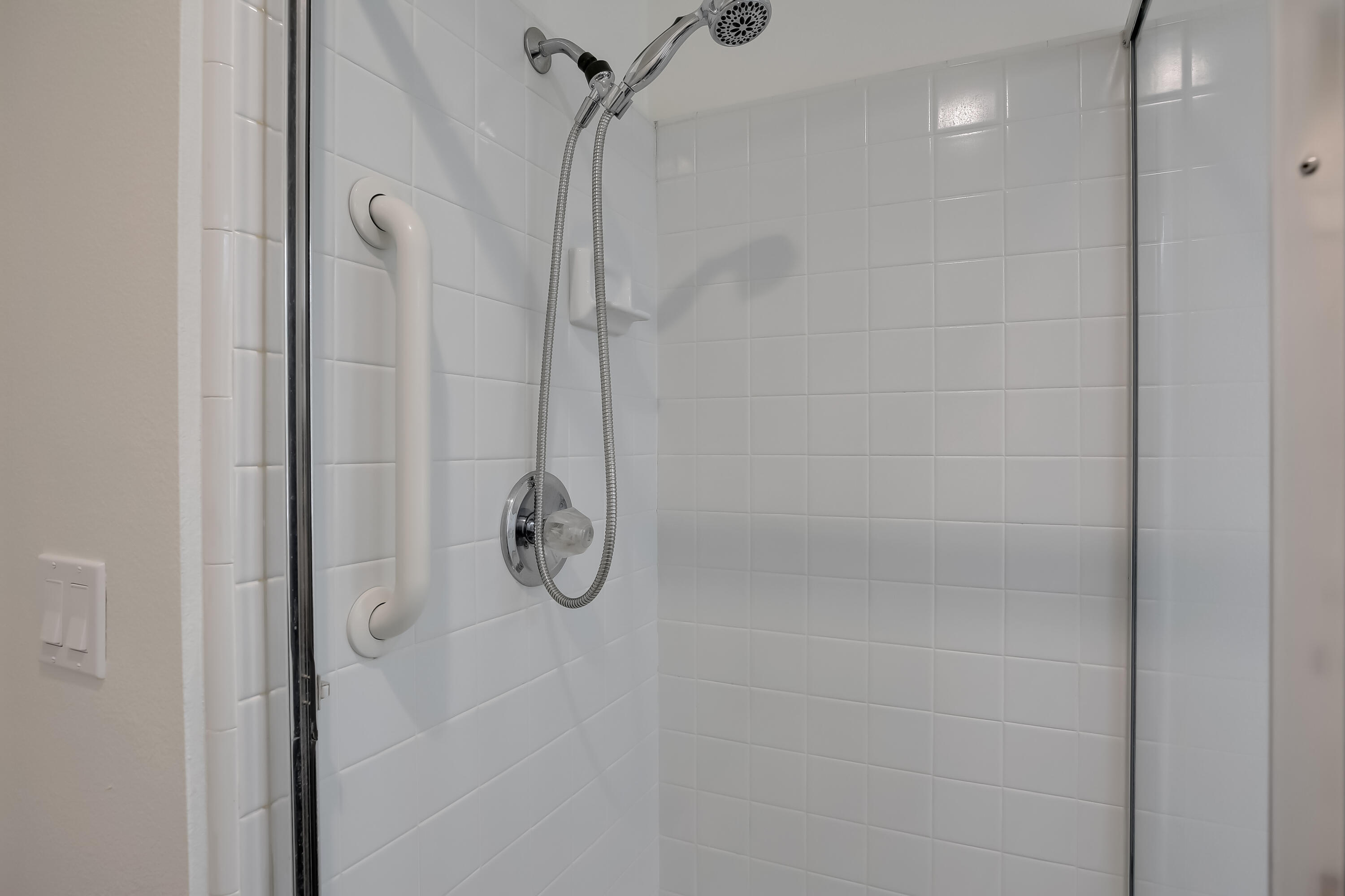 317 5th Street, Unit C Solvang, CA 93463 - Photo 18 of 24 a bathroom with a glass shower door