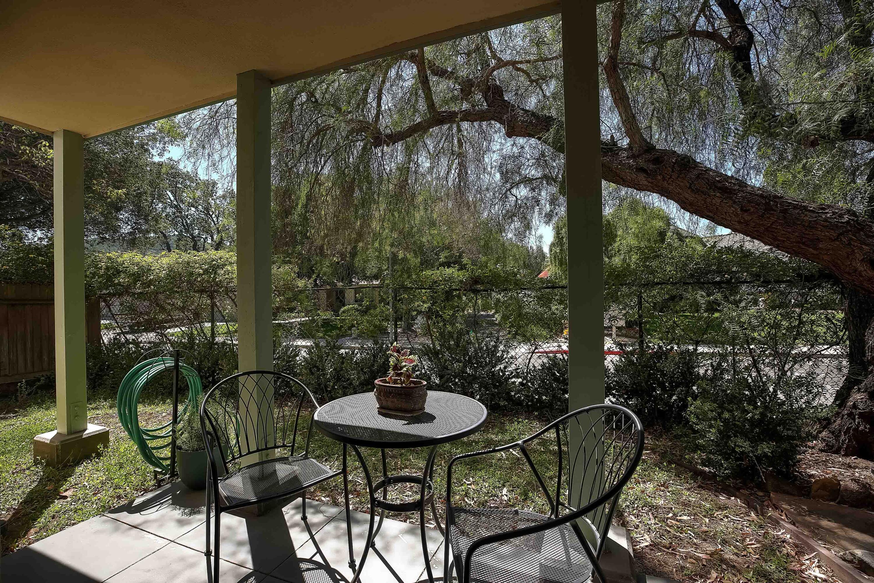 317 5th Street, Unit C Solvang, CA 93463 - Photo 20 of 24 a view of a balcony with chairs and a table
