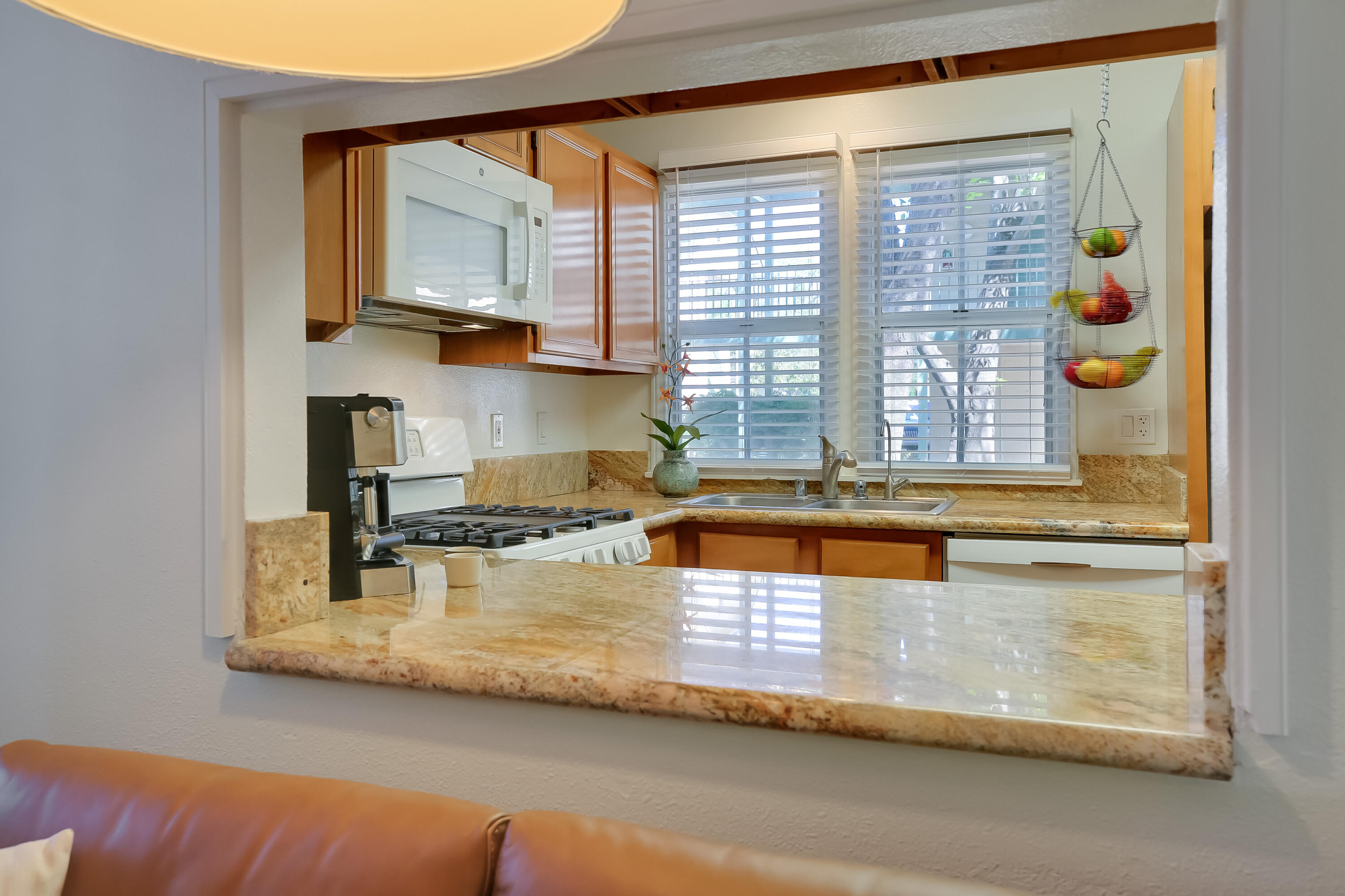 317 5th Street, Unit C Solvang, CA 93463 - Photo 9 of 24 a kitchen with stainless steel appliances granite countertop a sink and a window