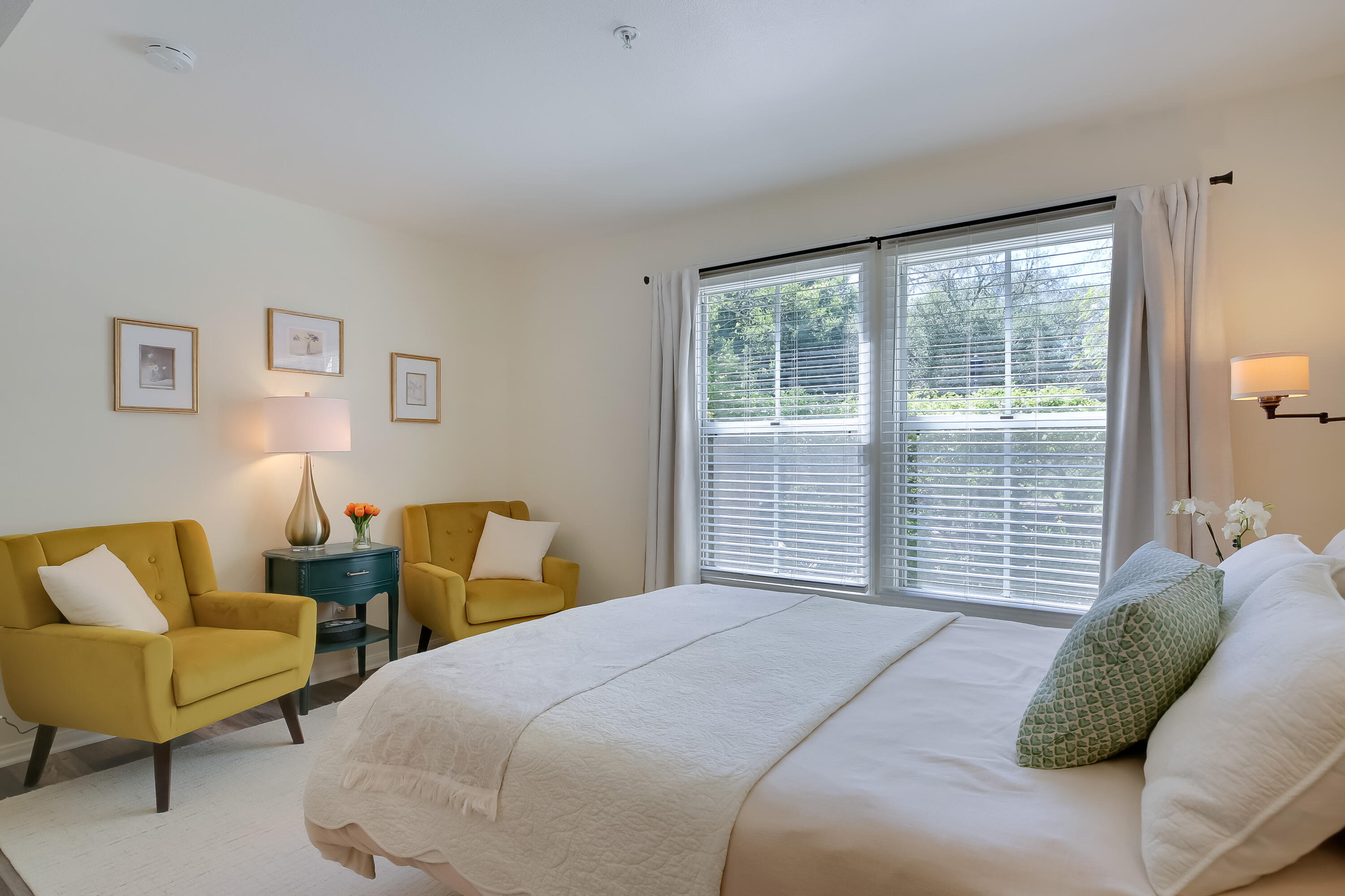 317 5th Street, Unit C Solvang, CA 93463 - Photo 10 of 24 a bedroom with two beds and a large window