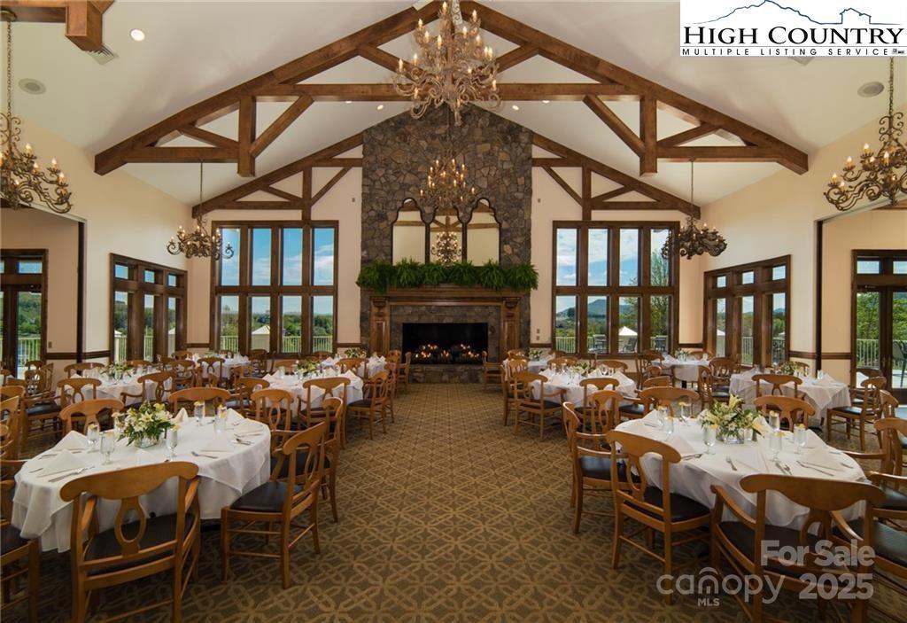 Tbd Olde Charter Circle, Unit 49 Jefferson, NC 28640 - Photo 5 of 11 a living room with furniture a fireplace and a table