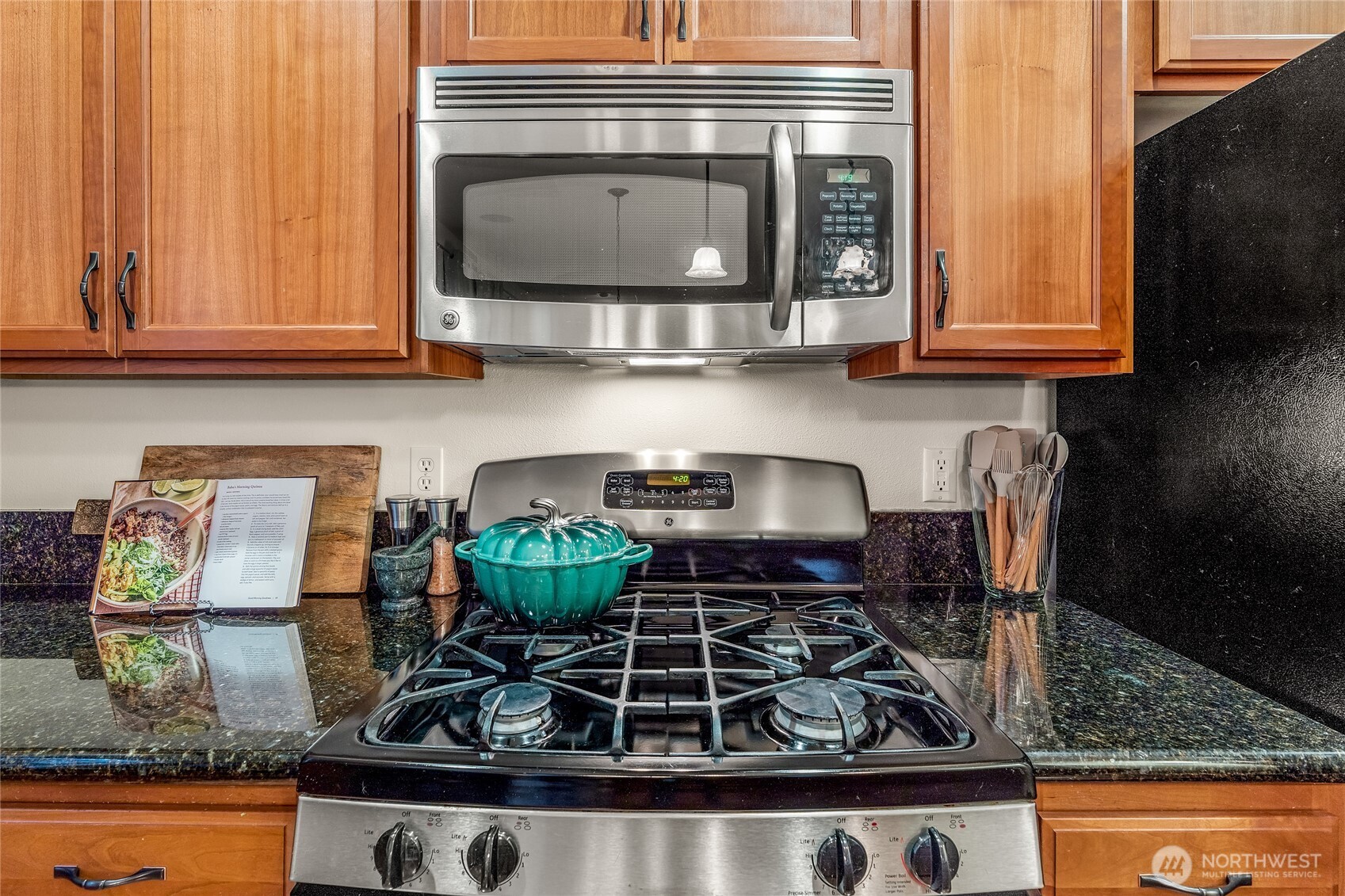 16239 2nd Place South Seattle, WA 98148 - Photo 14 of 40 a kitchen with a stove and a cabinets