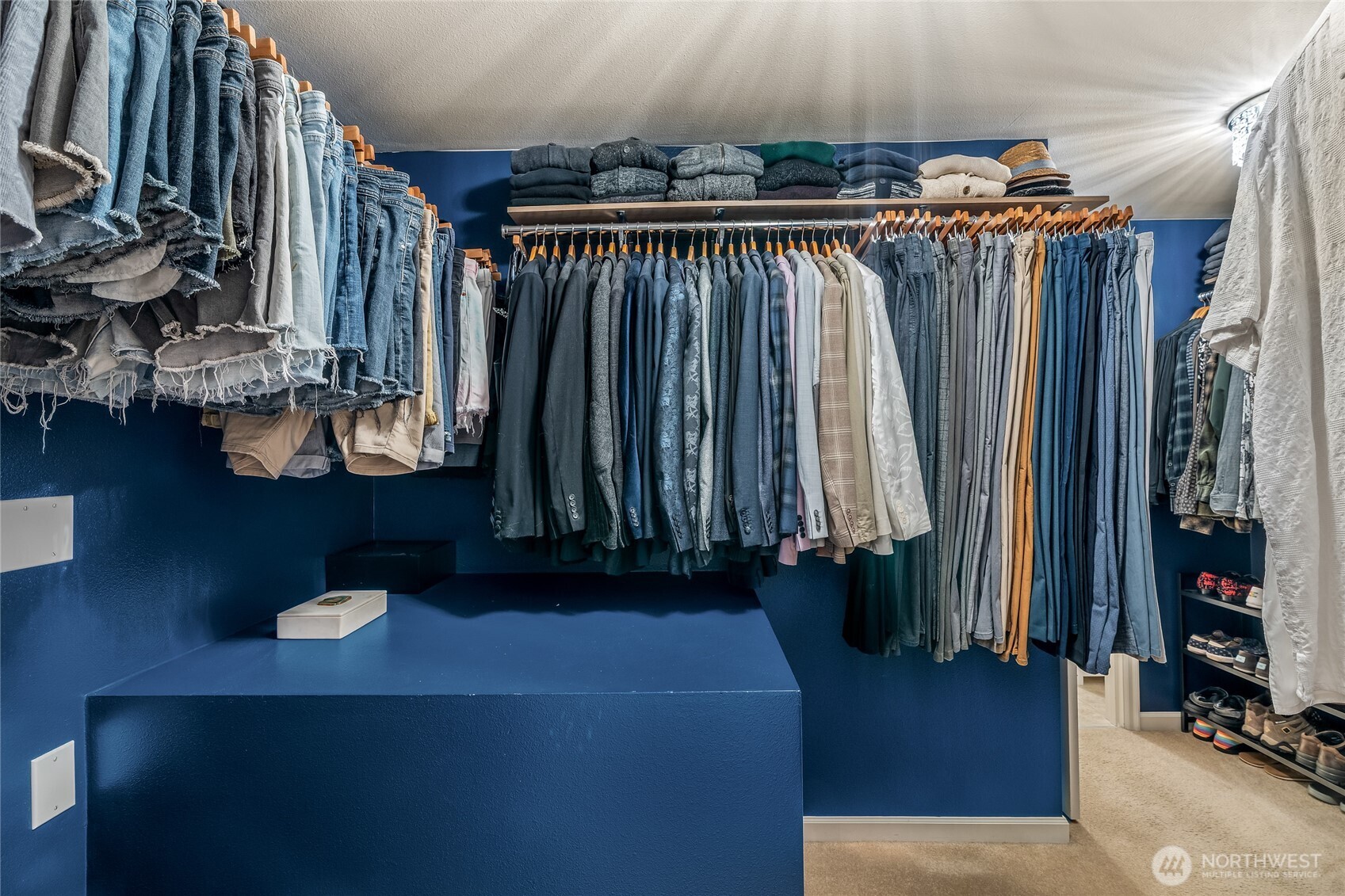16239 2nd Place South Seattle, WA 98148 - Photo 23 of 40 a view of walk in closet with clothes and shoes