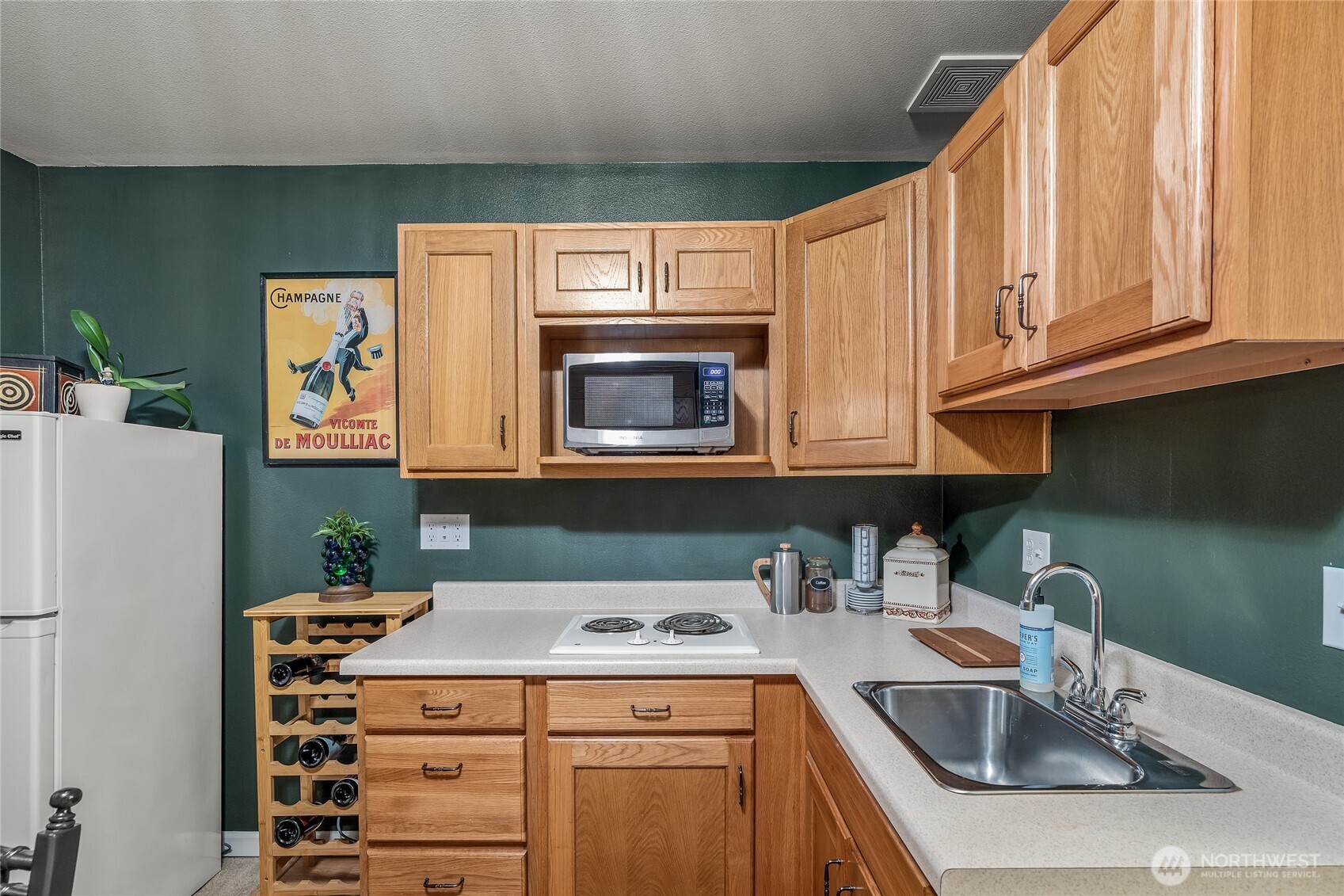 16239 2nd Place South Seattle, WA 98148 - Photo 35 of 40 a kitchen with stainless steel appliances granite countertop a sink stove and refrigerator
