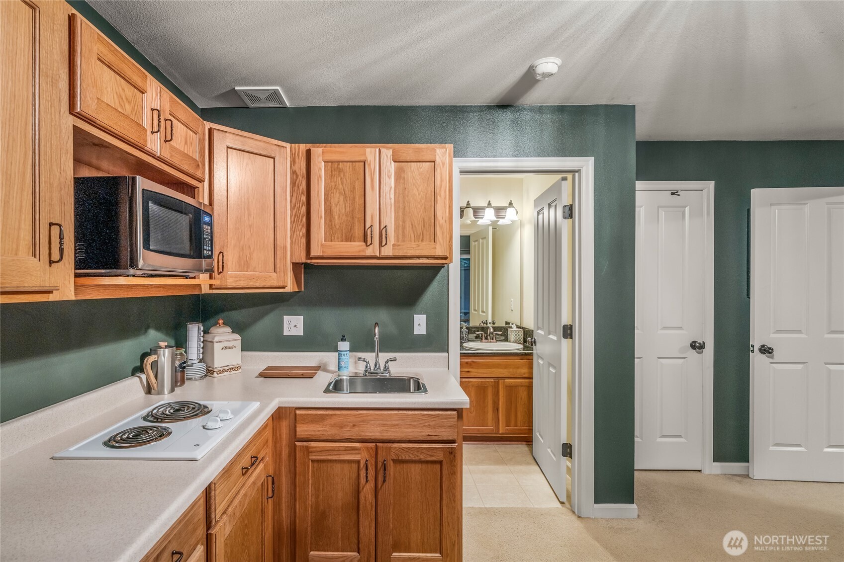 16239 2nd Place South Seattle, WA 98148 - Photo 36 of 40 a kitchen with stainless steel appliances granite countertop a sink refrigerator and cabinets