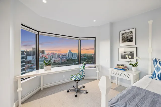 a living room with a couch and a large window