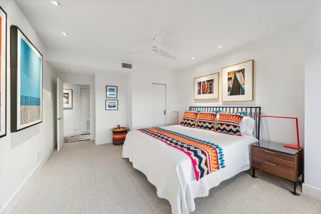 a bathroom with a sink and a large mirror next to a window