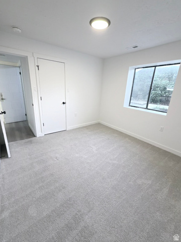 227 South West Lane Provo, UT 84601 - Photo 21 of 25 Bright interior space featuring light gray carpeting and white walls
