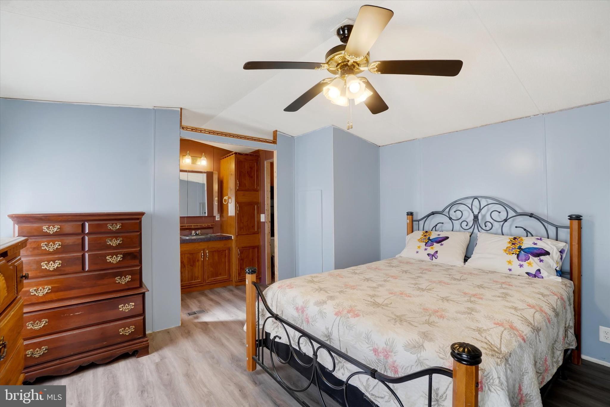 700 Salem Road Etters, PA 17319 - Photo 8 of 16 a bedroom with a bed and a chandelier