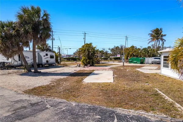 a view of a park with palm trees
