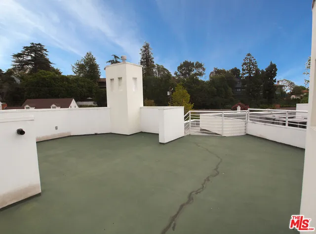 a view of a room with a kitchen