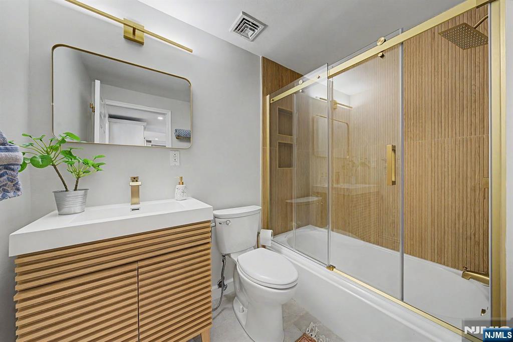 45 Highfield Road Bloomfield, NJ 07003 - Photo 16 of 50 a bathroom with a sink a toilet and shower