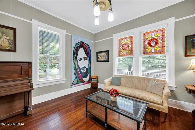 a view of a dining room with furniture and wooden floor