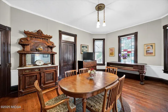 a dining room with furniture and window
