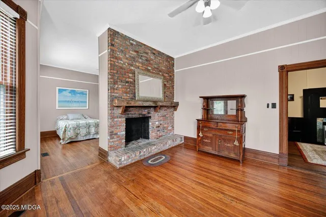 a kitchen with stainless steel appliances granite countertop a stove and a view of living room