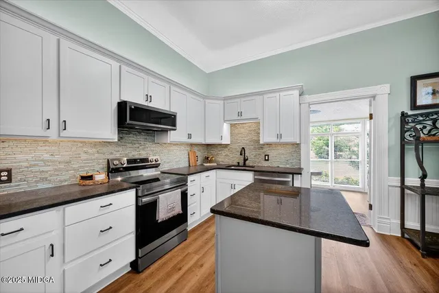 a view of a livingroom with wooden floor