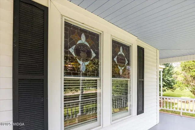 a view of a door and a window