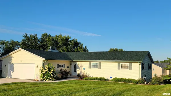 a view front of house with a garden